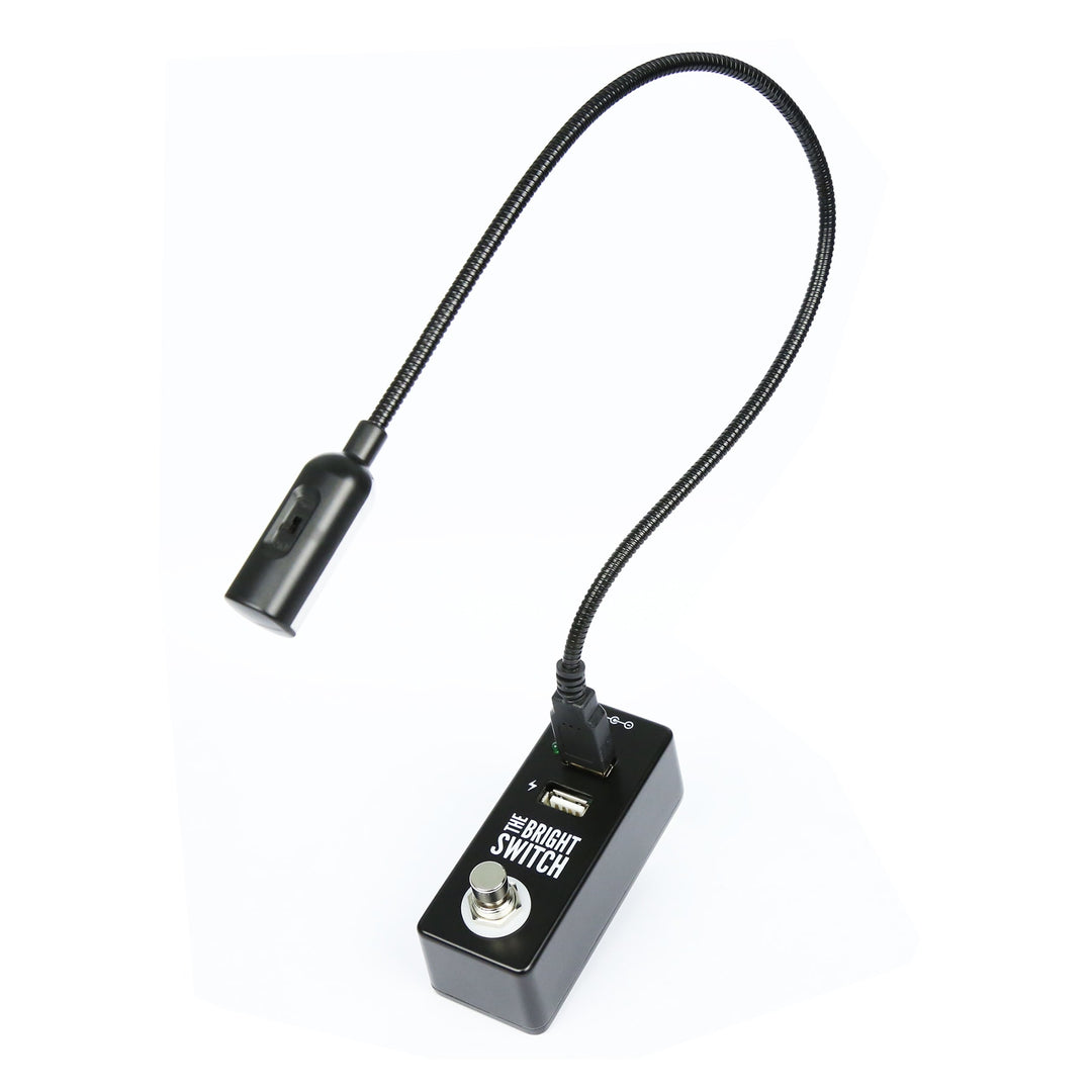 The Bright Switch pedal by Rock Stock, equipped with a USB port for powering a bright light that effectively illuminates a pedalboard. An indispensable tool for guitarists to conveniently manage and adjust their sound settings, even in low-light stages.